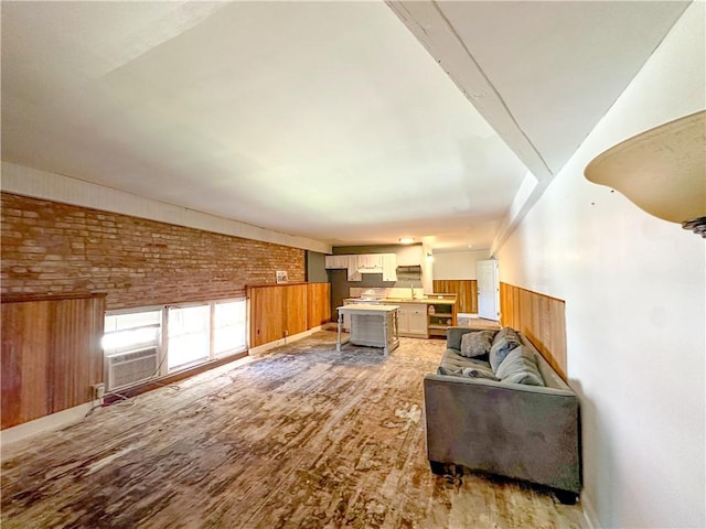 108 Public Sq, Berryville, AR 72616 - living area featuring brick wall, light wood-type flooring, and cooling unit