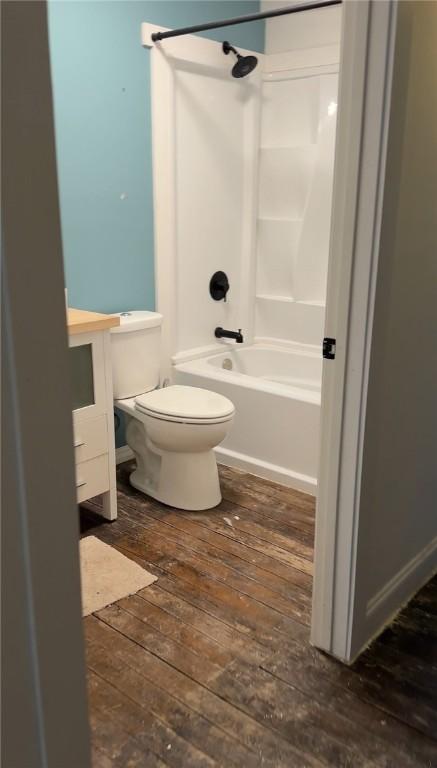 108 Public Sq, Berryville, AR 72616 - full bathroom featuring shower / bath combination, vanity, and hardwood / wood-style floors