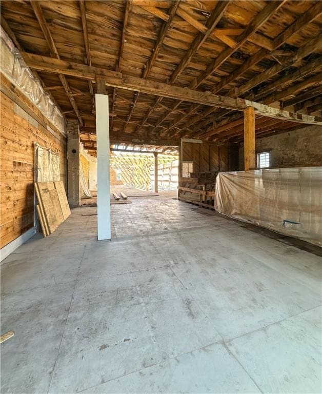 108 Public Sq, Berryville, AR 72616 - miscellaneous room featuring healthy amount of natural light, concrete flooring, and wooden walls
