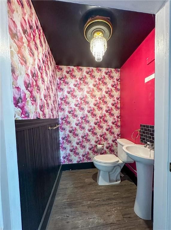 108 Public Sq, Berryville, AR 72616 - half bathroom featuring wood finished floors and toilet