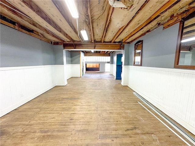 108 Public Sq, Berryville, AR 72616 - corridor featuring a wainscoted wall and wood-type flooring