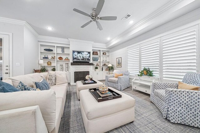 9116 Kirkwood Rdg, Fort Smith, AR 72916 - living area featuring ornamental molding, a ceiling fan, wood finished floors, a fireplace, and recessed lighting