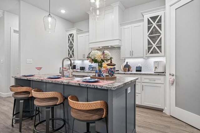 9116 Kirkwood Rdg, Fort Smith, AR 72916 - kitchen featuring white cabinetry, tasteful backsplash, light wood-style floors, and recessed lighting
