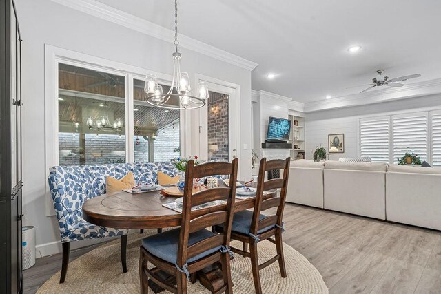 9116 Kirkwood Rdg, Fort Smith, AR 72916 - dining room with crown molding, light wood-style floors, ceiling fan, a chandelier, and recessed lighting