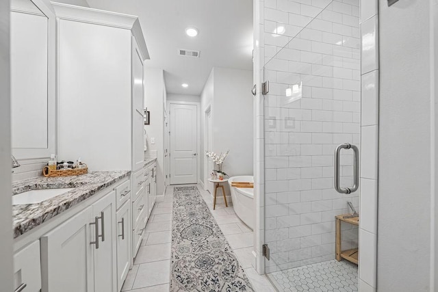 9116 Kirkwood Rdg, Fort Smith, AR 72916 - full bathroom featuring vanity, a shower stall, tile patterned flooring, a soaking tub, and recessed lighting