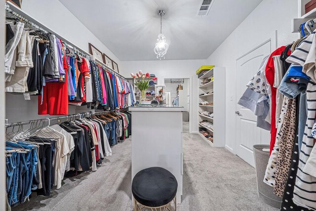 9116 Kirkwood Rdg, Fort Smith, AR 72916 - walk in closet with carpet floors and a chandelier