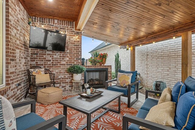9116 Kirkwood Rdg, Fort Smith, AR 72916 - view of patio with an outdoor living space with a fireplace