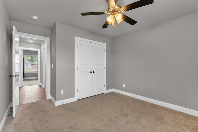 328 N Otoe St, Farmington, AR 72730 - unfurnished bedroom with carpet flooring, a closet, and ceiling fan