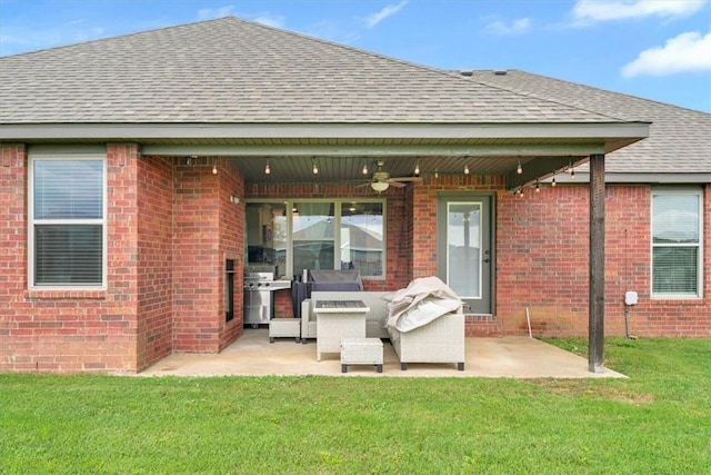 328 N Otoe St, Farmington, AR 72730 - back of house featuring roof with shingles, ceiling fan, a yard, and a patio