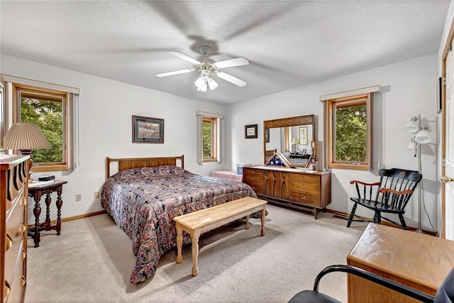 8553 Stoner Ln, Rogers, AR 72756 - bedroom featuring multiple windows, light carpet, a textured ceiling, and a ceiling fan