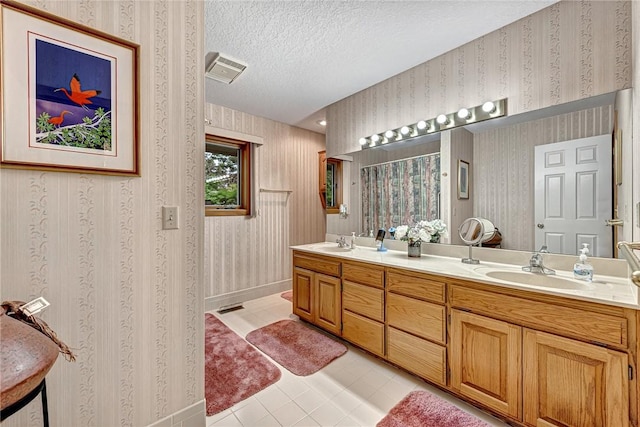 8553 Stoner Ln, Rogers, AR 72756 - full bathroom featuring double vanity, wallpapered walls, tile patterned floors, a textured ceiling, and a shower with curtain