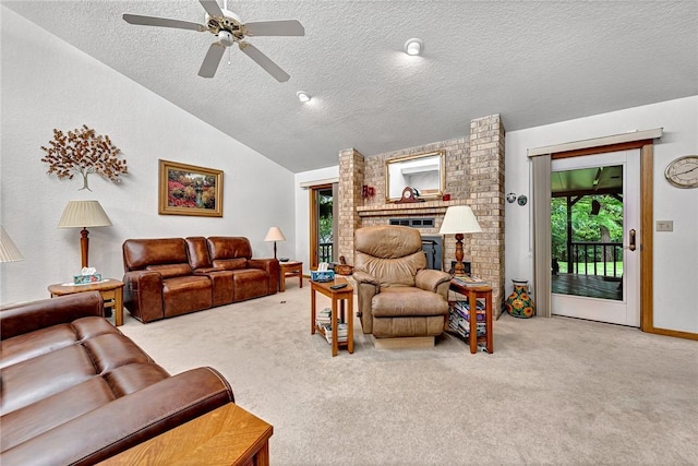 8553 Stoner Ln, Rogers, AR 72756 - living room with a textured ceiling, carpet flooring, a fireplace, a ceiling fan, and vaulted ceiling