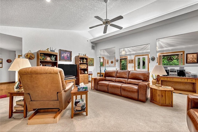 8553 Stoner Ln, Rogers, AR 72756 - living room featuring carpet flooring, lofted ceiling, a textured ceiling, and ceiling fan