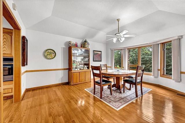 8553 Stoner Ln, Rogers, AR 72756 - dining area with vaulted ceiling, light wood-style flooring, and ceiling fan