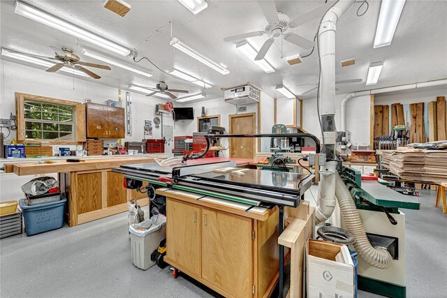 8553 Stoner Ln, Rogers, AR 72756 - miscellaneous room with ceiling fan and a workshop area