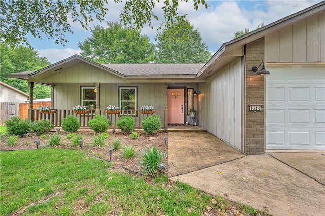 1314 N Fieldstone Ave, Fayetteville, AR 72704 - single story home featuring an attached garage, roof with shingles, and a porch