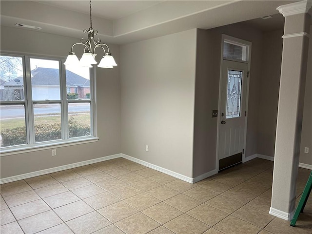1207 E Liberty, Siloam Springs, AR 72761 - unfurnished dining area with a chandelier, healthy amount of natural light, light tile patterned floors, and decorative columns