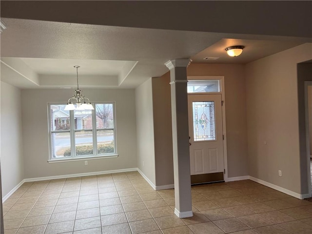 1207 E Liberty, Siloam Springs, AR 72761 - entryway featuring light tile patterned floors, a chandelier, a raised ceiling, and ornate columns