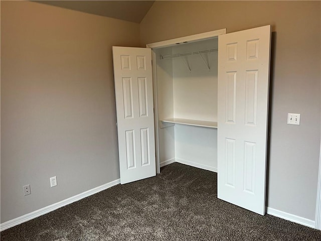 1207 E Liberty, Siloam Springs, AR 72761 - unfurnished bedroom featuring dark colored carpet, lofted ceiling, and a closet