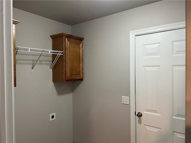 1207 E Liberty, Siloam Springs, AR 72761 - washroom with electric dryer hookup and cabinet space