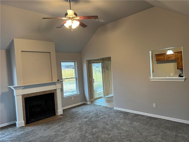 1207 E Liberty, Siloam Springs, AR 72761 - unfurnished living room featuring vaulted ceiling, ceiling fan, carpet floors, and a fireplace