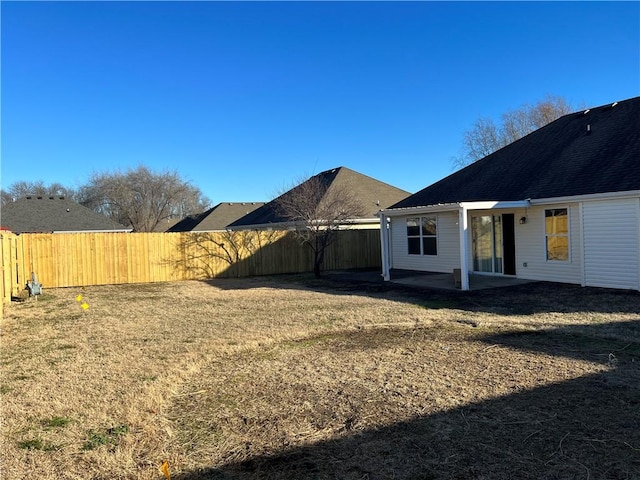 1207 E Liberty, Siloam Springs, AR 72761 - fenced backyard with a patio