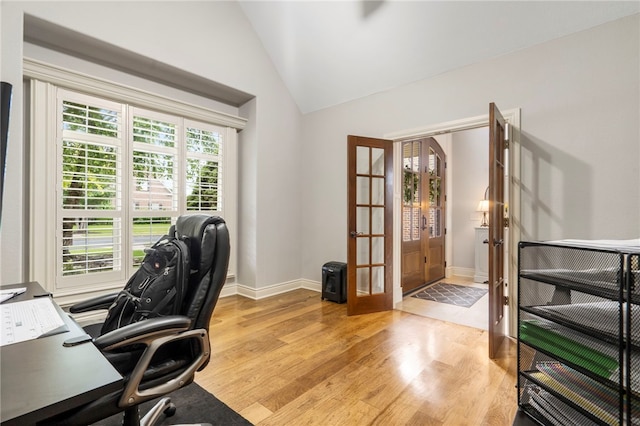 501 SE Fullerton St, Bentonville, AR 72712 - home office with french doors, lofted ceiling, and light wood finished floors