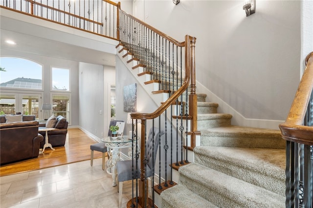 501 SE Fullerton St, Bentonville, AR 72712 - stairway with a towering ceiling and tile patterned floors