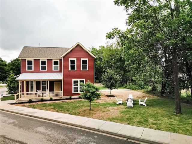 315 E 11th St, Fayetteville, AR 72701 - view of front of house featuring covered porch and a front lawn