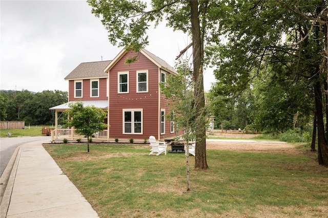 315 E 11th St, Fayetteville, AR 72701 - view of front facade with covered porch and a front lawn