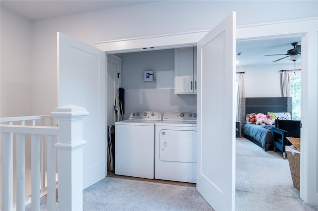 315 E 11th St, Fayetteville, AR 72701 - washroom featuring light carpet, washer and dryer, a ceiling fan, and cabinet space