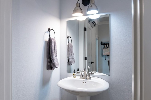 315 E 11th St, Fayetteville, AR 72701 - bathroom featuring a sink and a wall mounted air conditioner