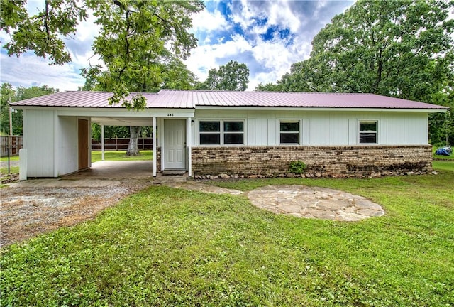 285 S 2nd St, Oaks, OK 74359 - single story home with brick siding, driveway, an attached carport, and a metal roof