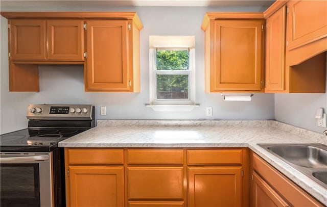 285 S 2nd St, Oaks, OK 74359 - kitchen with stainless steel electric stove and light countertops