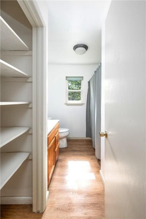 285 S 2nd St, Oaks, OK 74359 - full bathroom with wood finished floors, vanity, and a shower with shower curtain