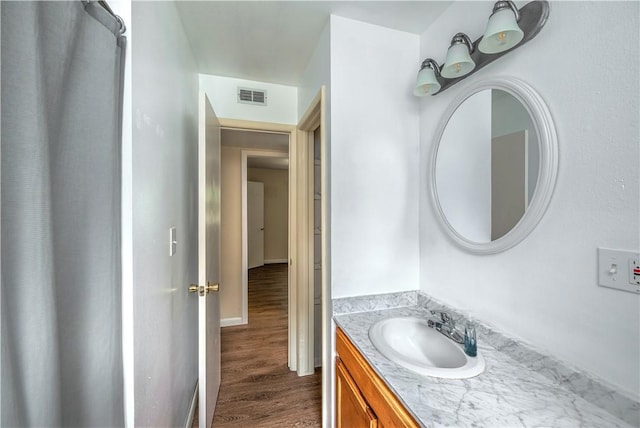 285 S 2nd St, Oaks, OK 74359 - bathroom with vanity and wood finished floors