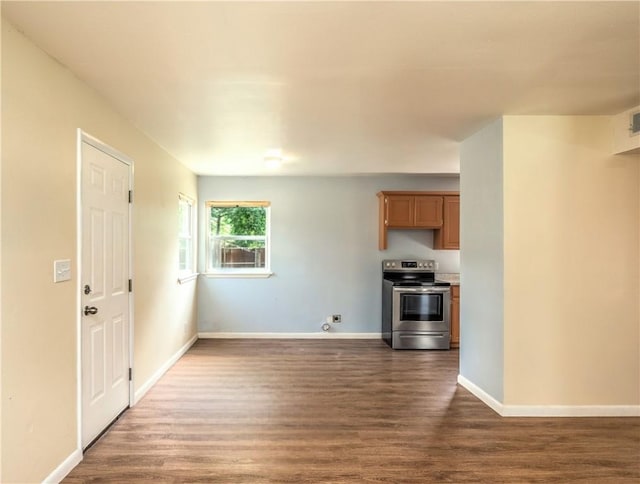 285 S 2nd St, Oaks, OK 74359 - unfurnished living room with dark wood-style floors and baseboards