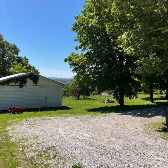 4841 Business Highway 412, Huntsville, AR 72740 - view of grassy yard featuring an outbuilding