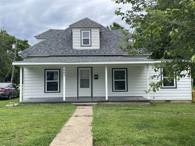 602 E Church Ave, Berryville, AR 72616 - view of front of home featuring a shingled roof, covered porch, and a front lawn