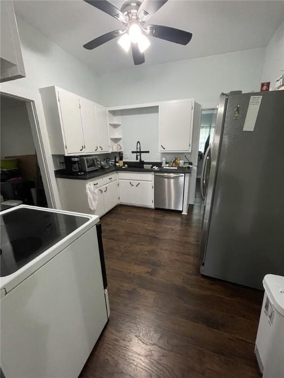 602 E Church Ave, Berryville, AR 72616 - kitchen with stainless steel appliances, dark wood-style flooring, a ceiling fan, white cabinets, and dark countertops