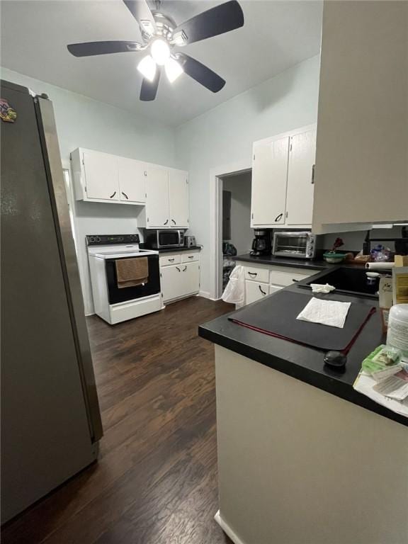 602 E Church Ave, Berryville, AR 72616 - kitchen with appliances with stainless steel finishes, white cabinetry, and dark countertops