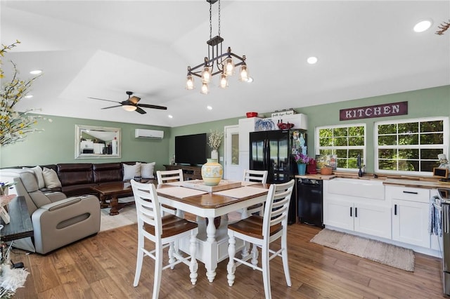 132 N Nature Trl Ln, Noel, MO 64854 - dining area featuring a ceiling fan, wood finished floors, a wall mounted AC, recessed lighting, and lofted ceiling