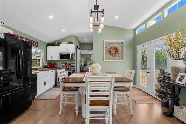 132 N Nature Trl Ln, Noel, MO 64854 - kitchen with black appliances, white cabinetry, plenty of natural light, light wood-style floors, and lofted ceiling