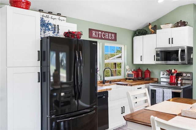 132 N Nature Trl Ln, Noel, MO 64854 - kitchen with black appliances, wooden counters, lofted ceiling, and white cabinets
