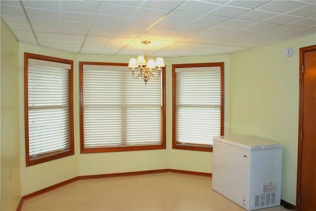 32 Table Rock Dr, Holiday Island, AR 72631 - unfurnished dining area with a chandelier and light carpet