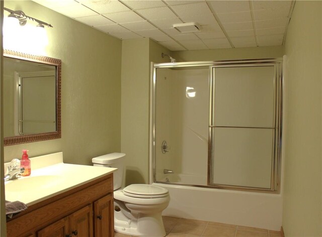 32 Table Rock Dr, Holiday Island, AR 72631 - bathroom with vanity, a paneled ceiling, tile patterned flooring, and enclosed tub / shower combo