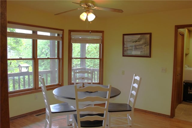 32 Table Rock Dr, Holiday Island, AR 72631 - dining area with light wood-style flooring and ceiling fan