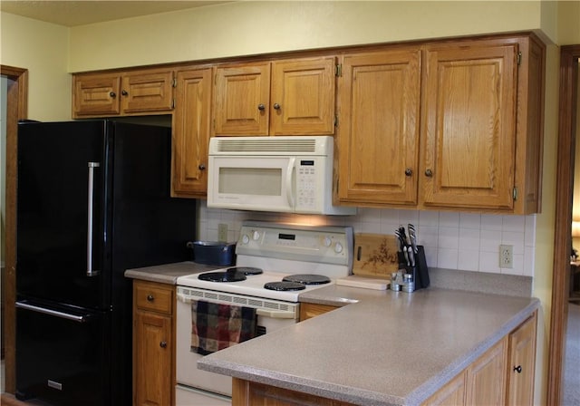 32 Table Rock Dr, Holiday Island, AR 72631 - kitchen with white appliances, tasteful backsplash, brown cabinets, and light countertops