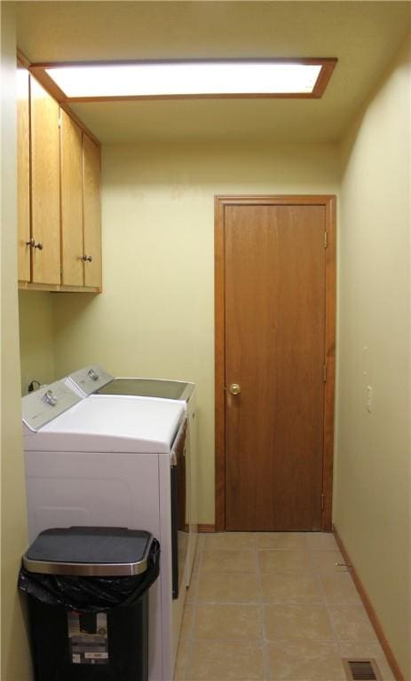 32 Table Rock Dr, Holiday Island, AR 72631 - washroom with cabinet space, independent washer and dryer, and light tile patterned floors