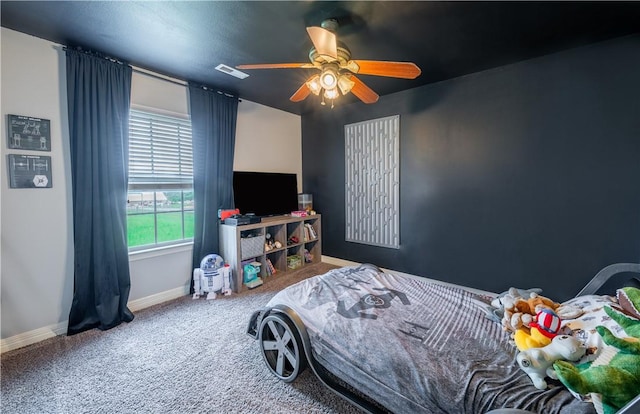 904 S Lafayette St, Rogers, AR 72758 - carpeted bedroom featuring baseboards and a ceiling fan